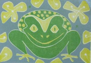 painting of smiling frog surrounded by leaves