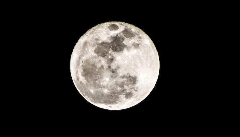 the moon against a black sky