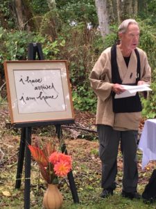 Anshin reading at a sangha celebration.