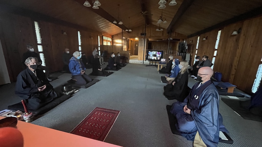 People sitting in meditation inside the Puget Sound Zen Center.