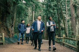 People walking in a forest.