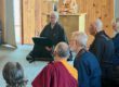 Shuko giving a dharma talk, with sangha members listening.